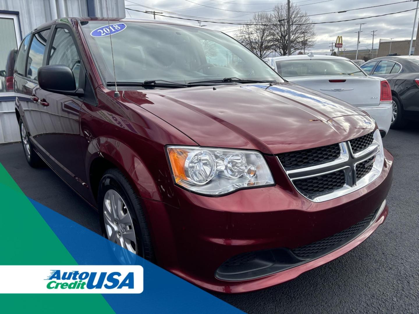 2018 RED DODGE GRAND CARAVAN SE SE (2C4RDGBG9JR) with an 3.6L V6 DOHC 24V engine, 6A transmission, located at 100 West Coliseum Boulevard, Fort Wayne, IN, 46805, (260) 471-0567, 41.118340, -85.141014 - 2018 DODGE GRAND CARAVAN SE SE - Photo#0