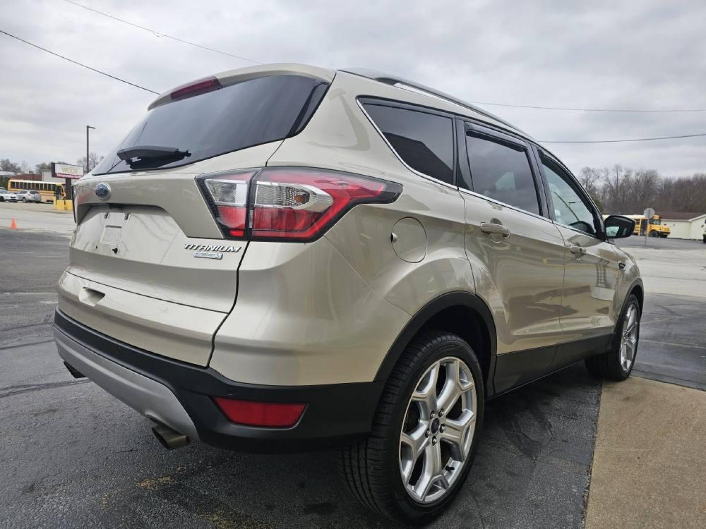 2017 GOLD /Tan Ford ESCAPE TITANIUM Titanium FWD (1FMCU0J90HU) with an 2.0L L4 DOHC 16V engine, 6A transmission, located at 502 South Main Street, Columbia City, IN, 46725, (260) 244-4645, 41.151382, -85.490578 - 2017 Ford ESCAPE TITANIUM Titanium FWD - Photo#3