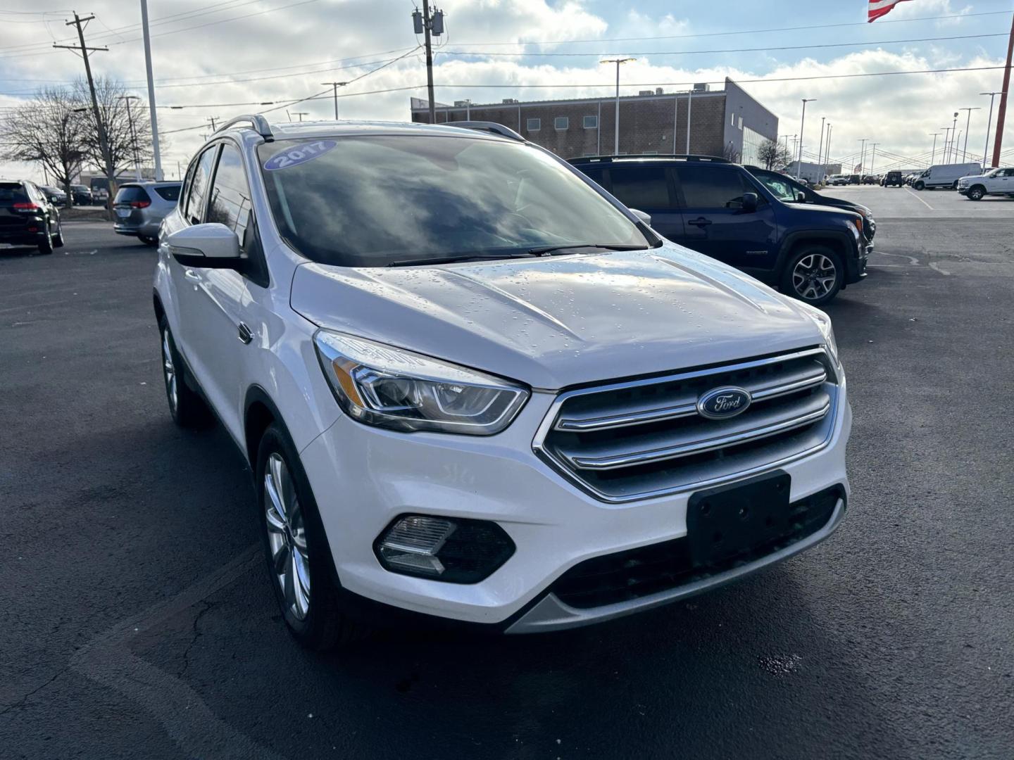 2017 WHITE Ford ESCAPE TITANIUM Titanium FWD (1FMCU0J9XHU) with an 2.0L L4 DOHC 16V engine, 6A transmission, located at 100 West Coliseum Boulevard, Fort Wayne, IN, 46805, (260) 471-0567, 41.118340, -85.141014 - 2017 Ford ESCAPE TITANIUM Titanium FWD - Photo#1
